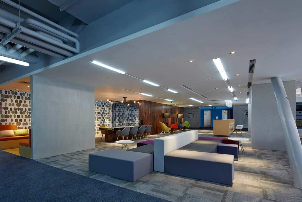 Break out area with multicoloured block seating - wide shot