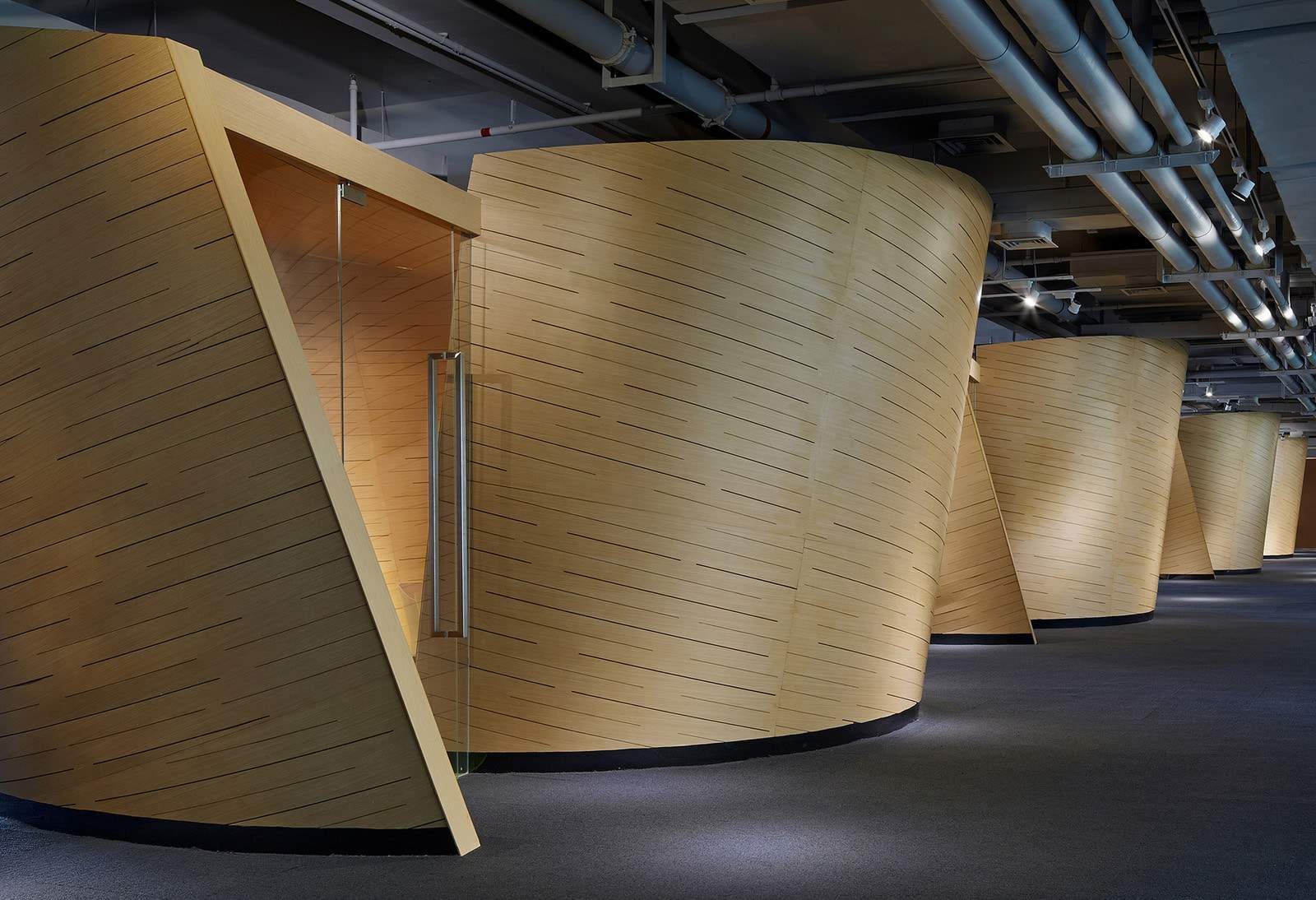 Curved wood framed office pods