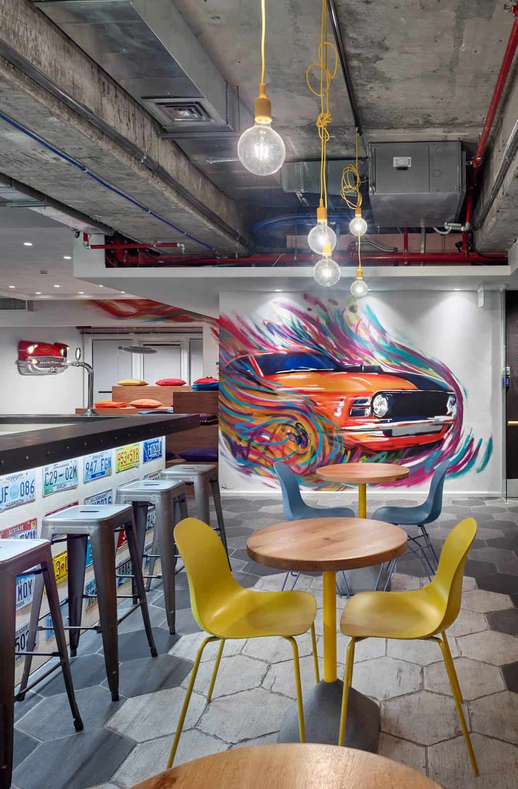 Breakout area with multicoloured car wall art