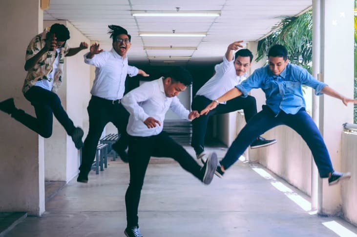 A group of employees jumping