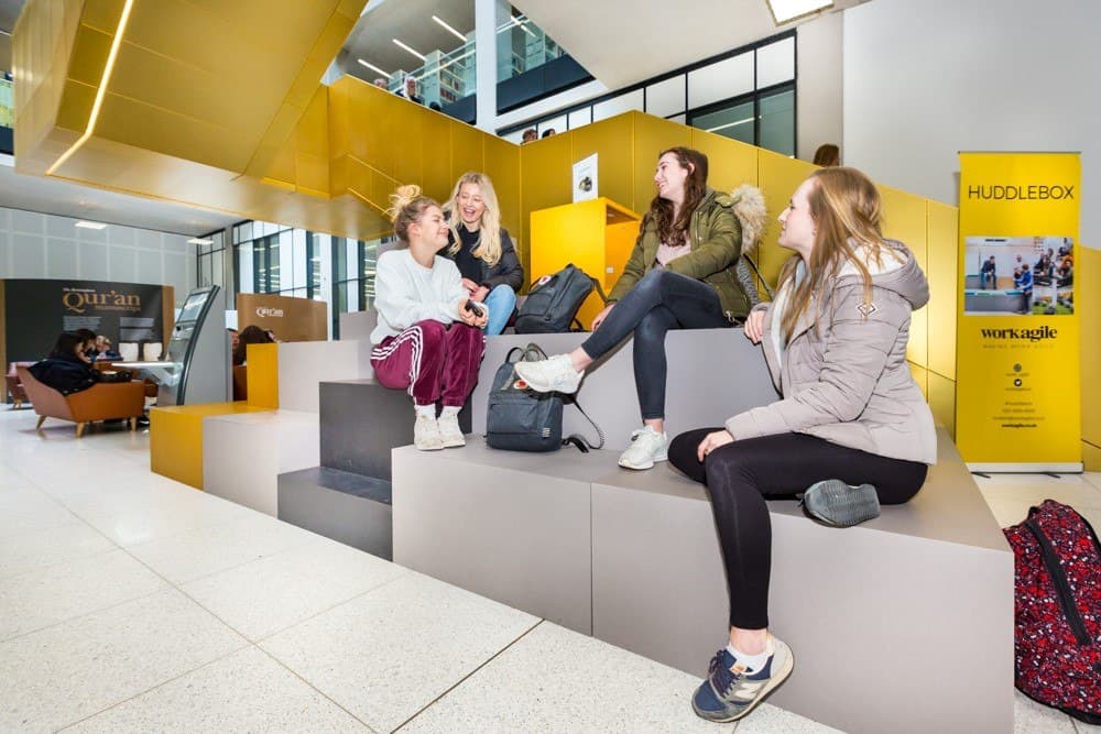 Students sitting on Workagile Huddlebox Display