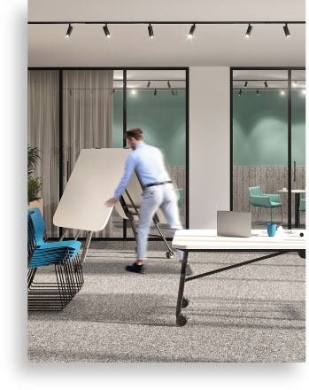Man folding a Workagile Nimble table into whiteboard mode