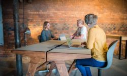 People working at a Mutu 1100 table